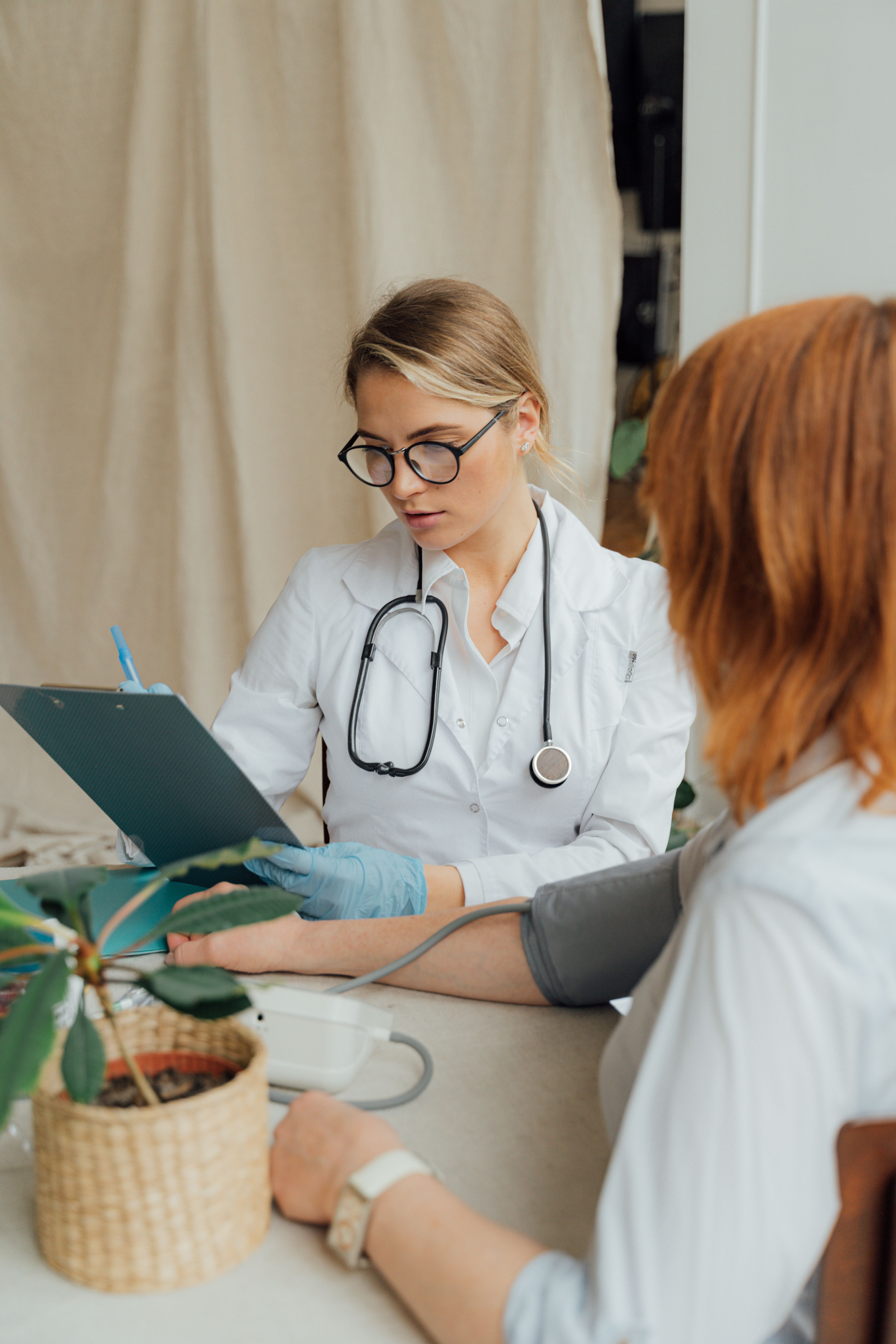 Provider reviewing a chart with a patient for Lenox Medical Clinic Roswell area care