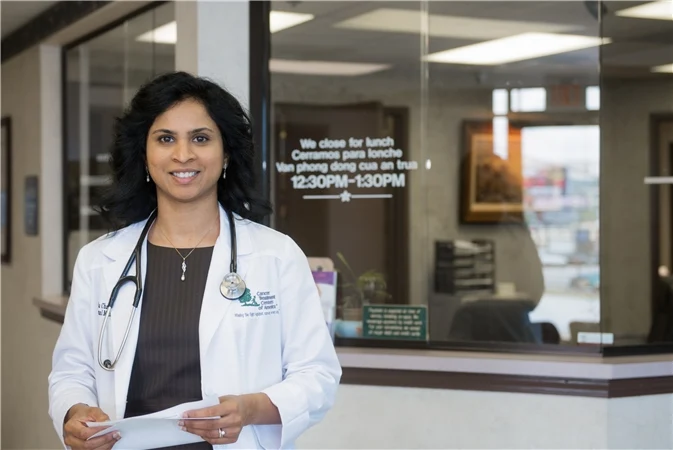 Dr. Sudha Challa with a patient at Lenox Medical Clinic in Doraville, GA